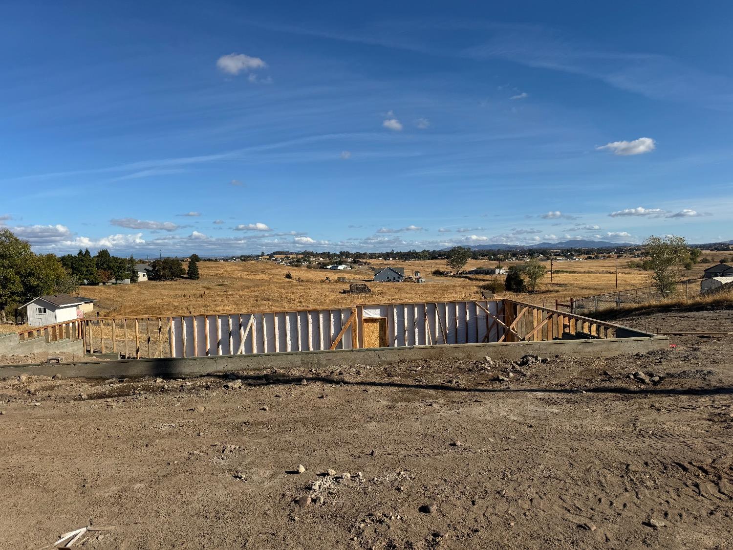 a view of a yard with an ocean view