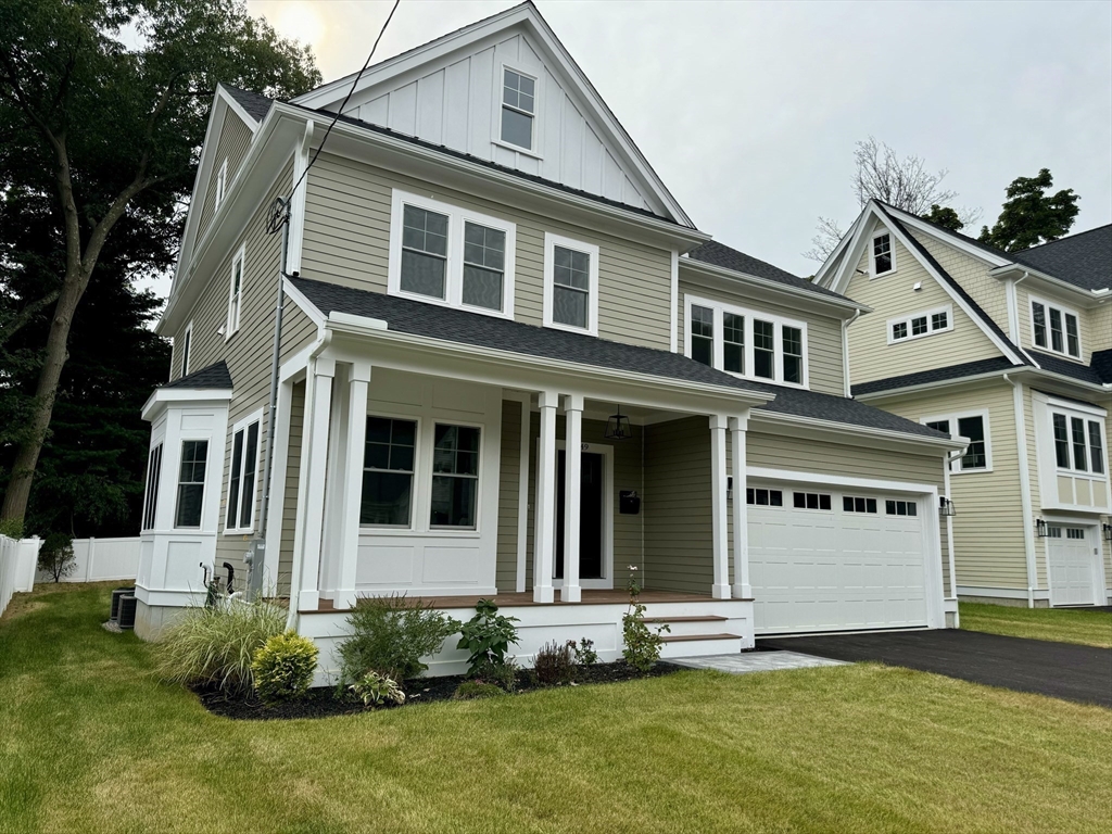 front view of a house with a yard