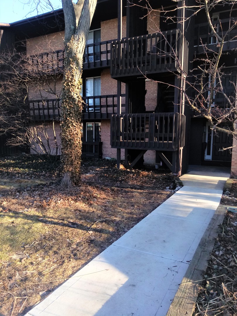 a view of a building with a tree