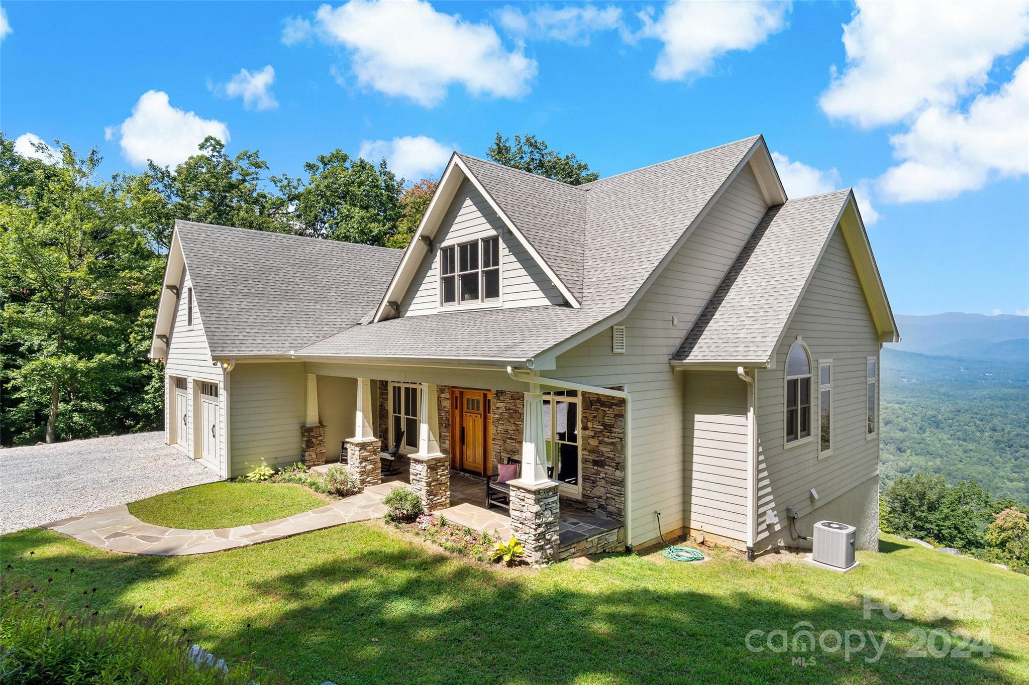 a view of a house with backyard porch and sitting area