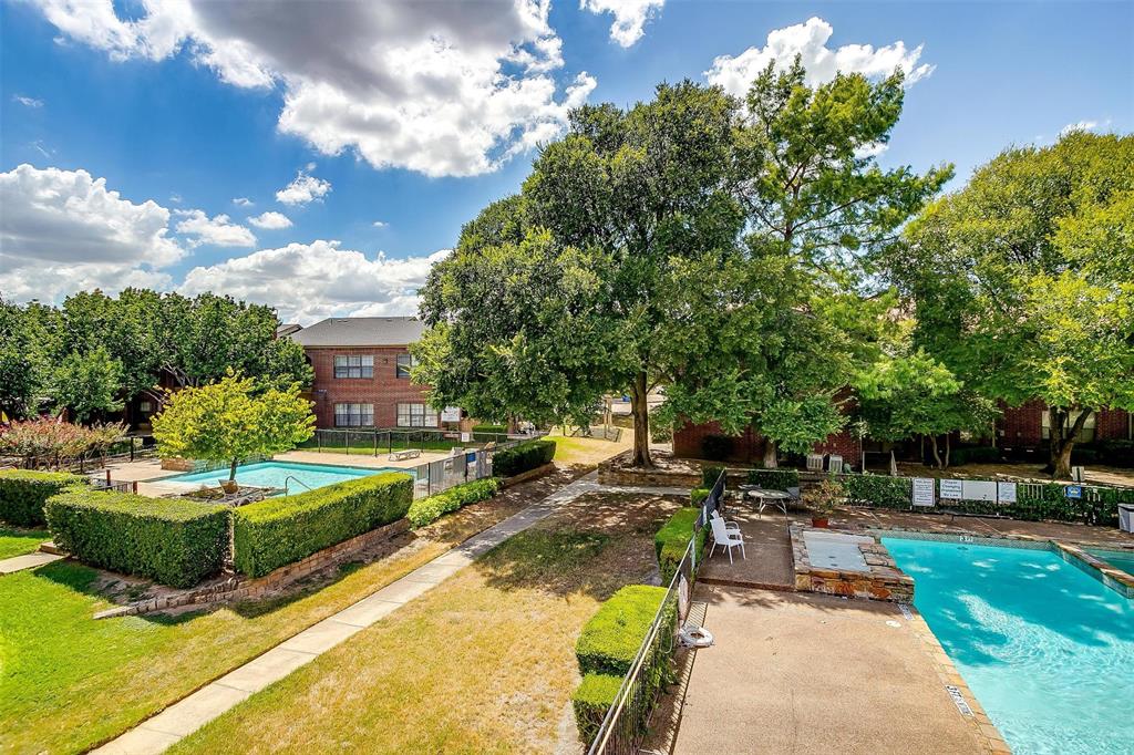 a swimming pool with outdoor seating and garden