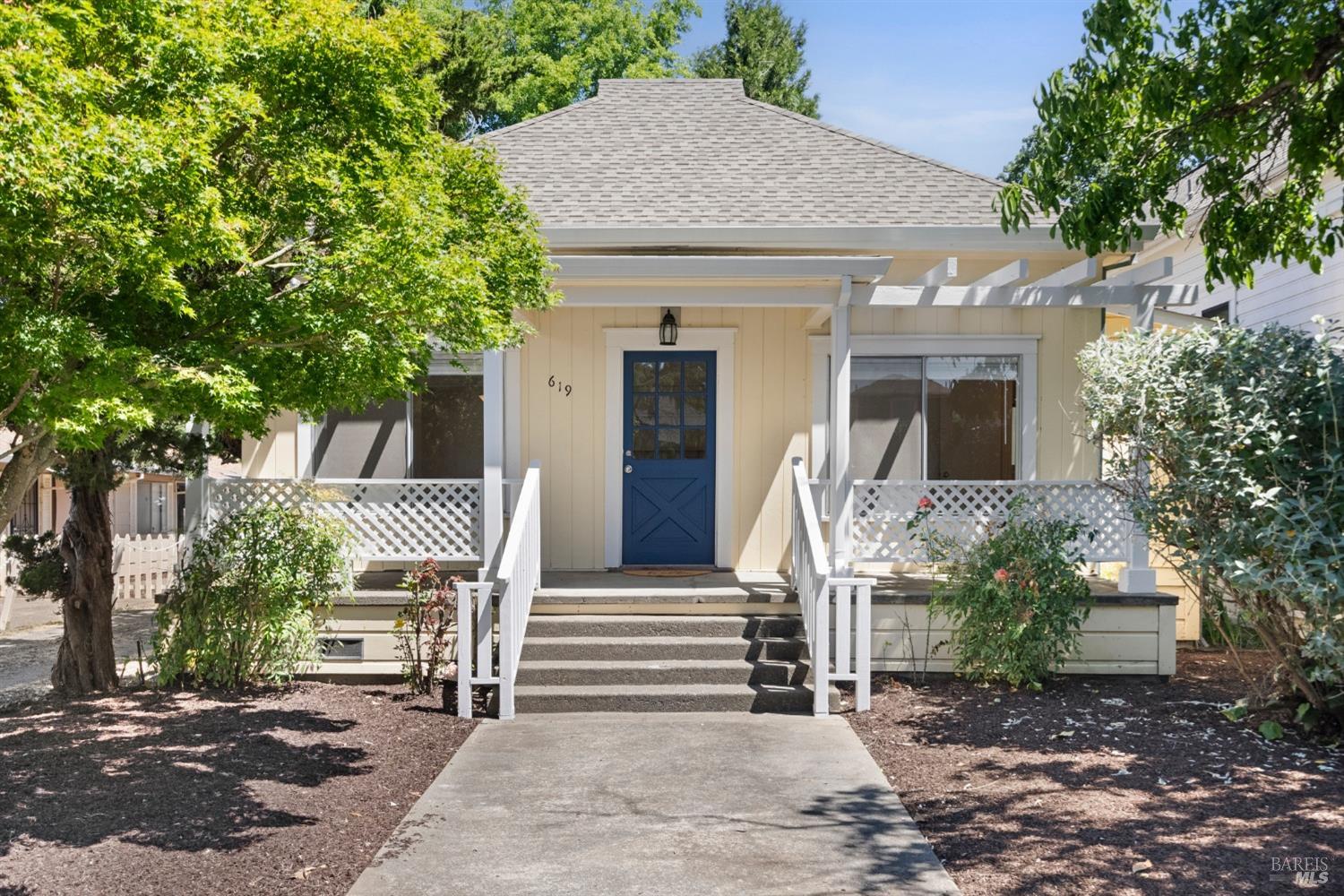 a front view of a house with garden