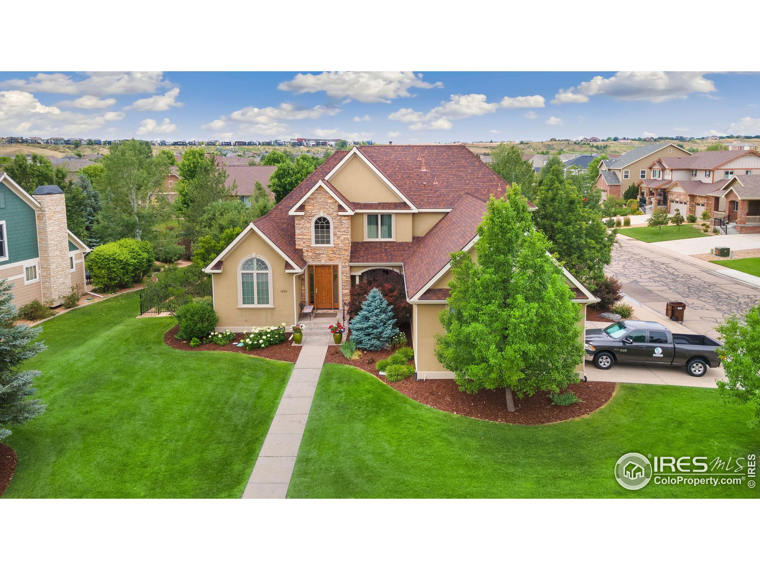 a aerial view of a house with a big yard