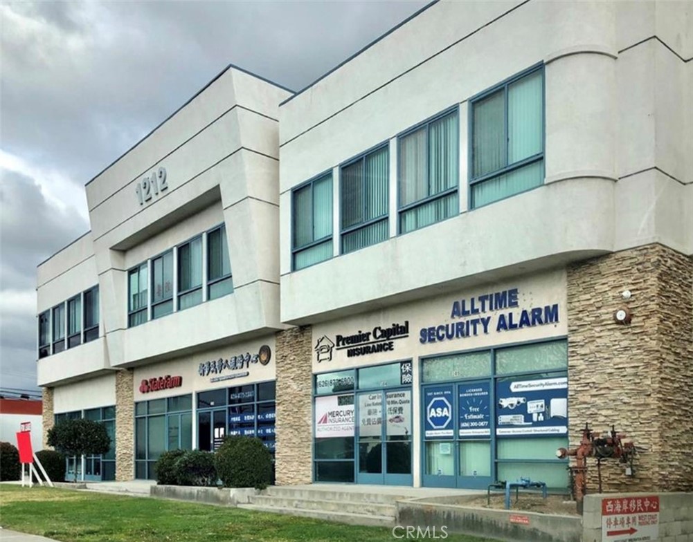 a front view of building with yard