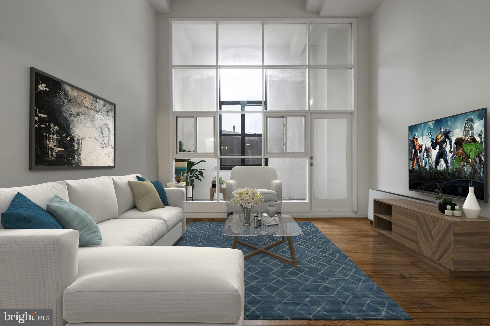 a living room with furniture and a flat screen tv