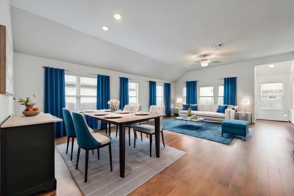 a view of a dining room with furniture window and wooden floor