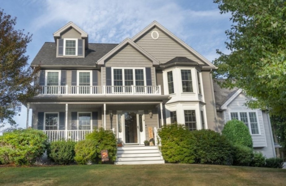 front view of a house with a yard