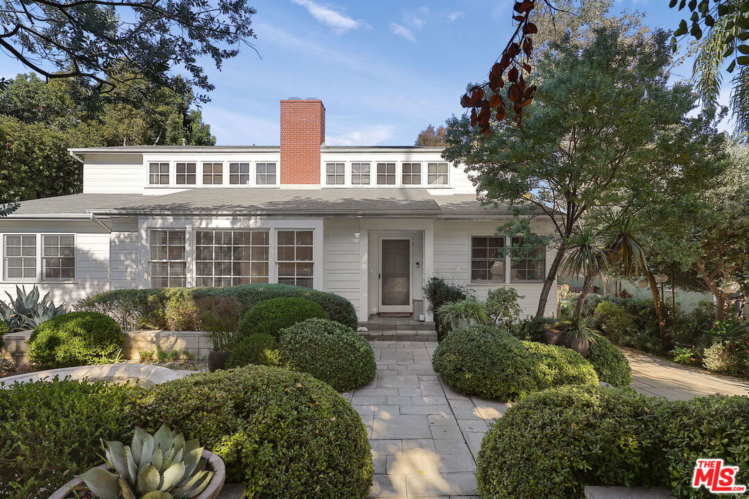 a house view with a garden space