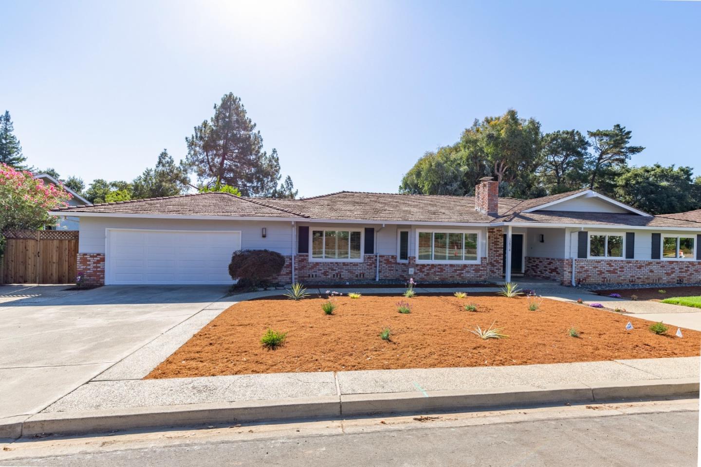 a front view of a house with yard patio and fire pit