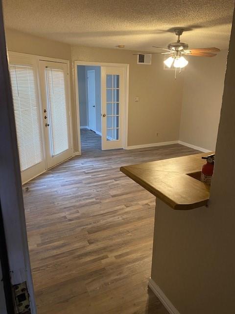 a room with a sink and chandelier