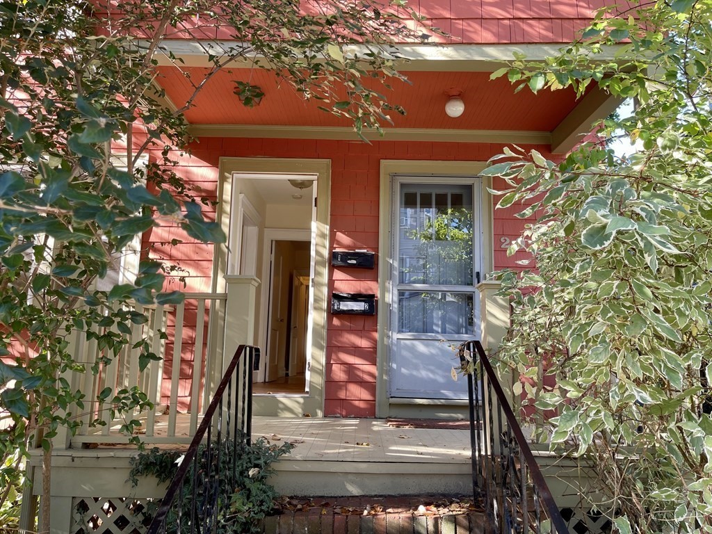 a view of a house with a tree