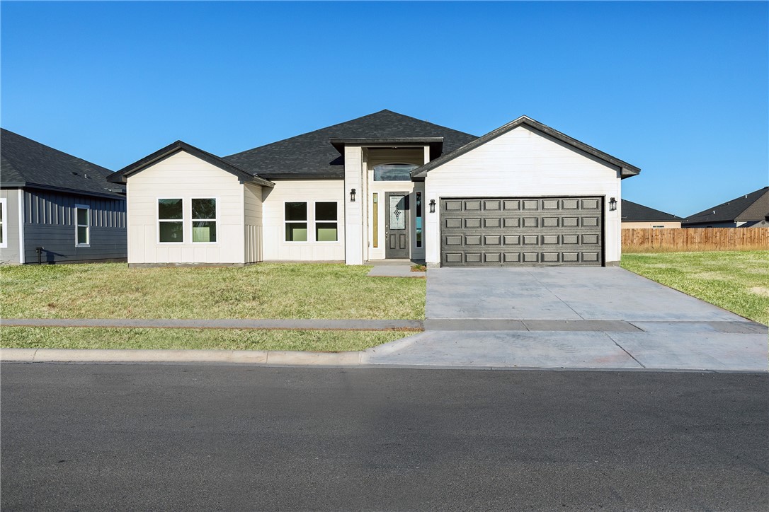 a front view of a house with yard