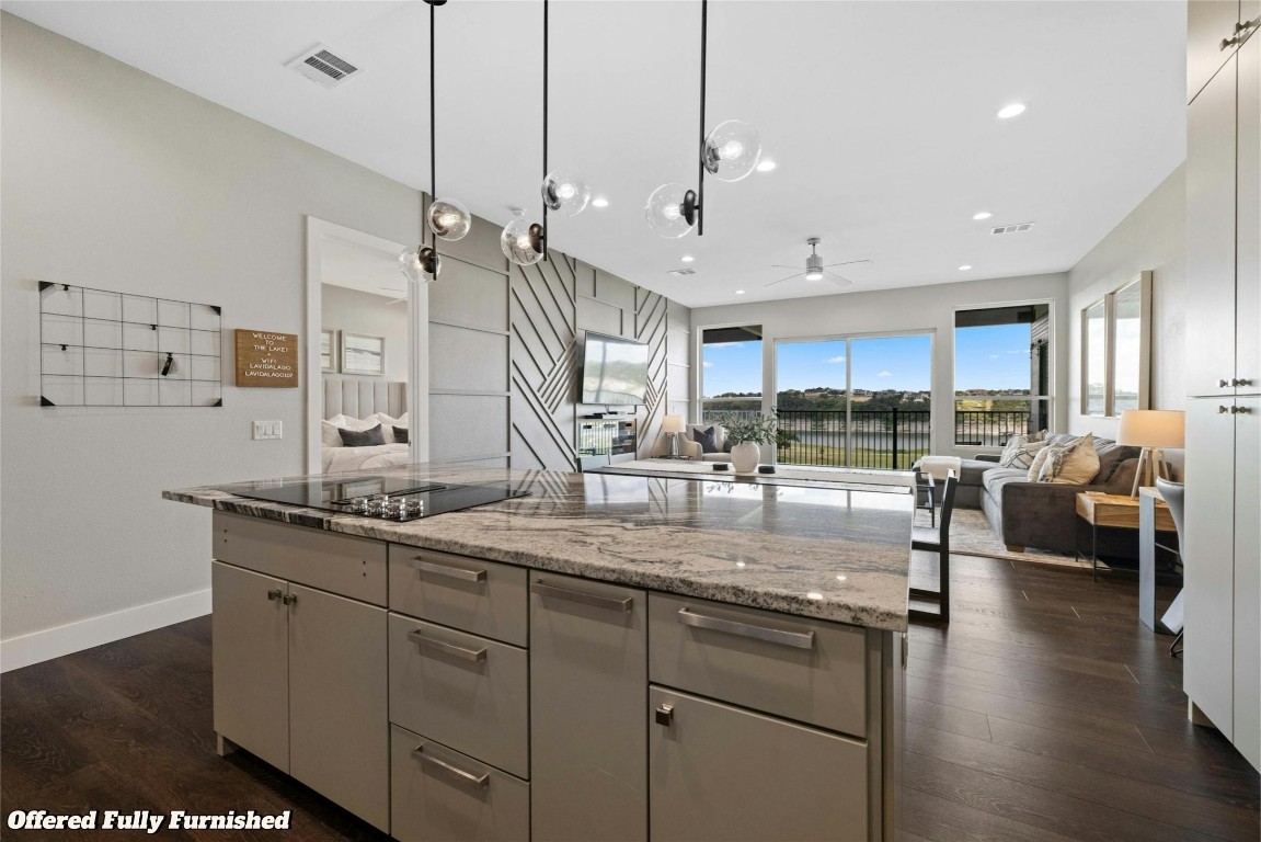 View from kitchen into living room with Cody Park and Lake Travis views