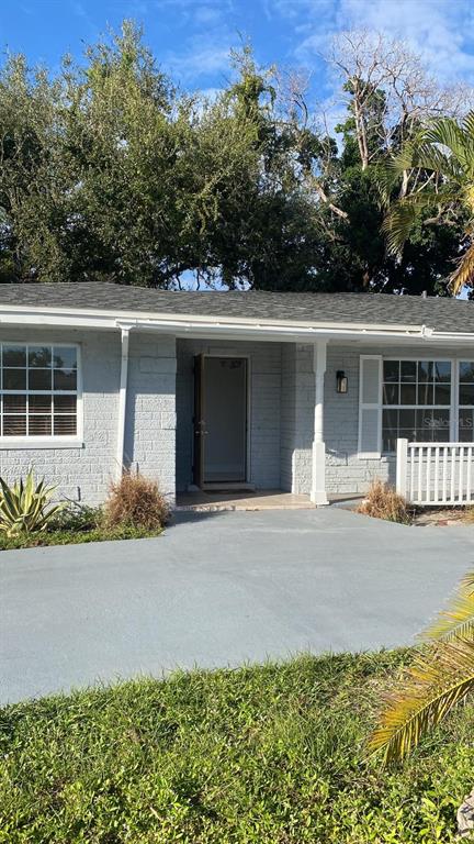 front view of a house with a yard