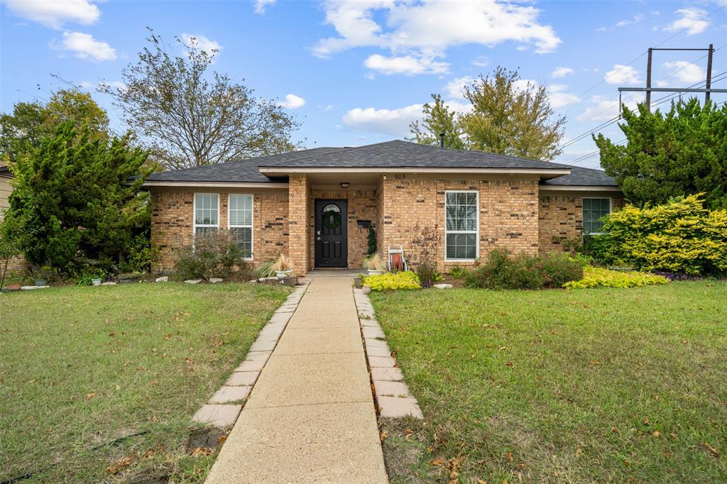 front view of a house with a yard