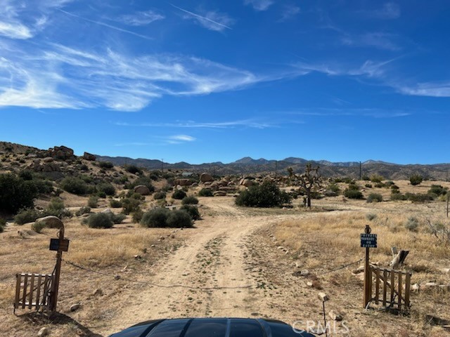 a view of outdoor space with mountain view in back