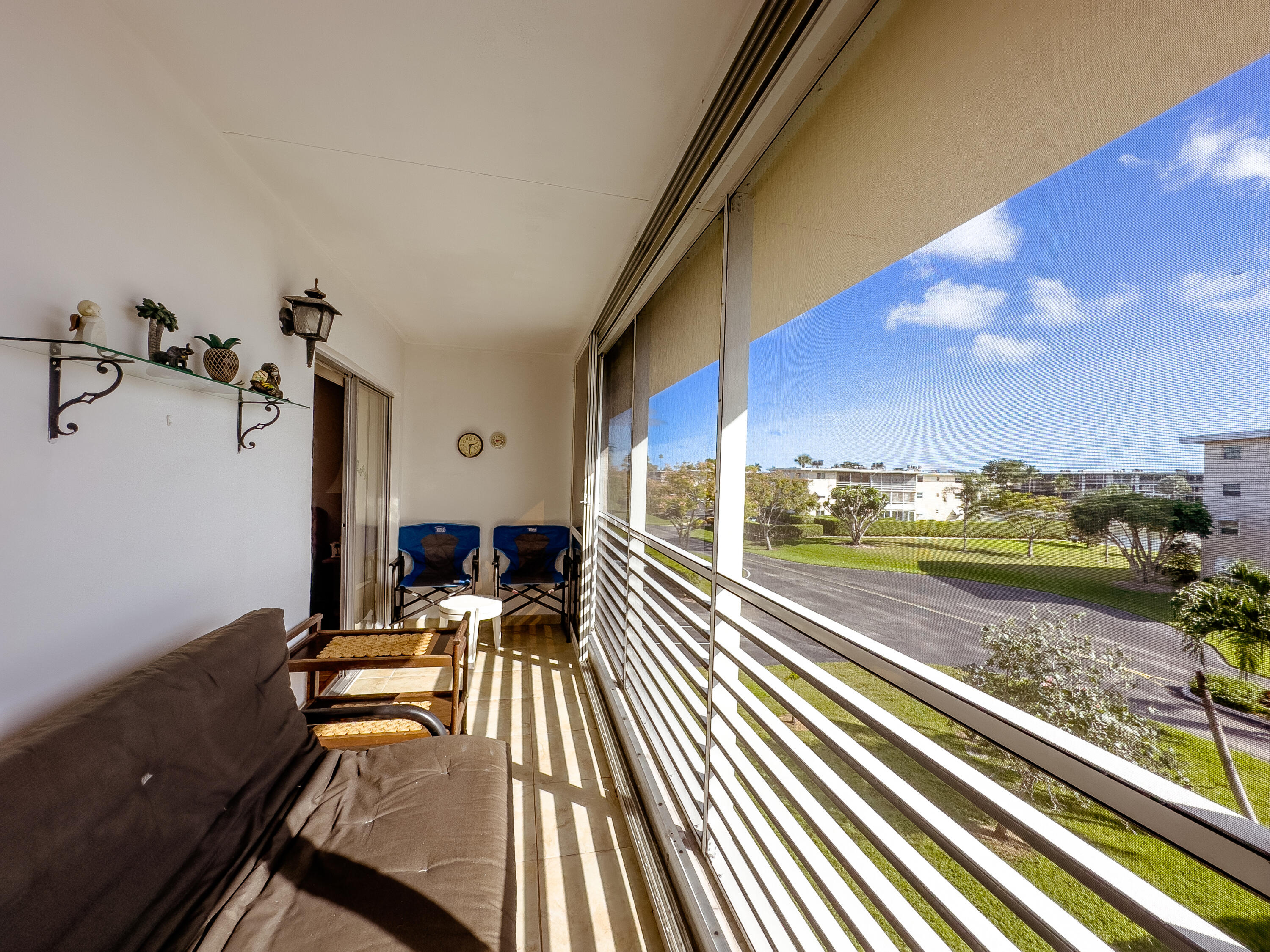 a view of a balcony with chairs