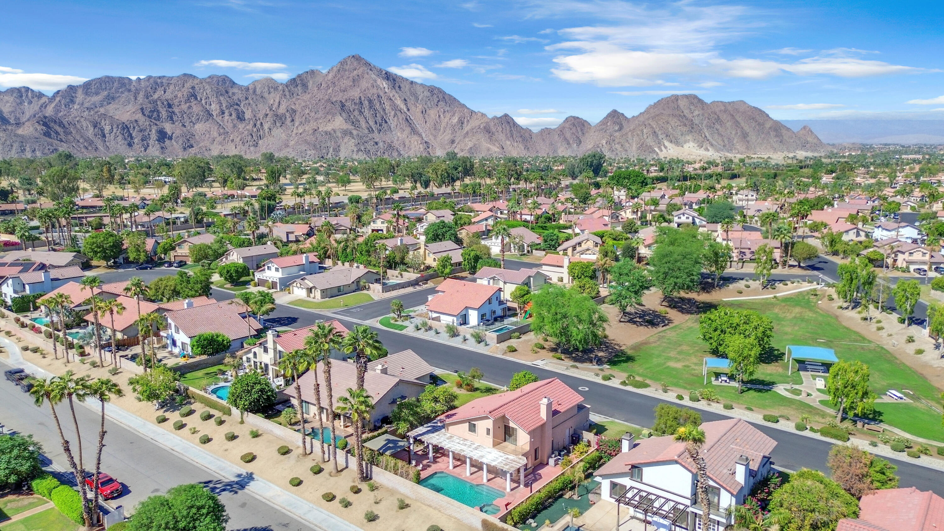 an aerial view of residential house and sandy dunes