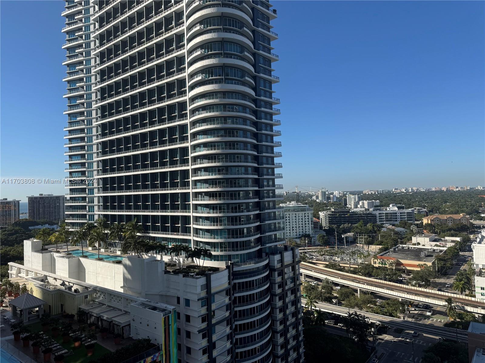 a view of a city with tall buildings