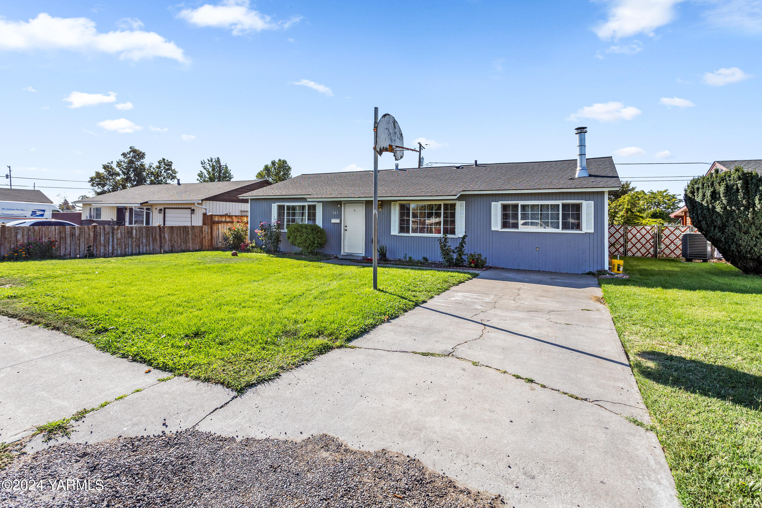 a front view of a house with yard