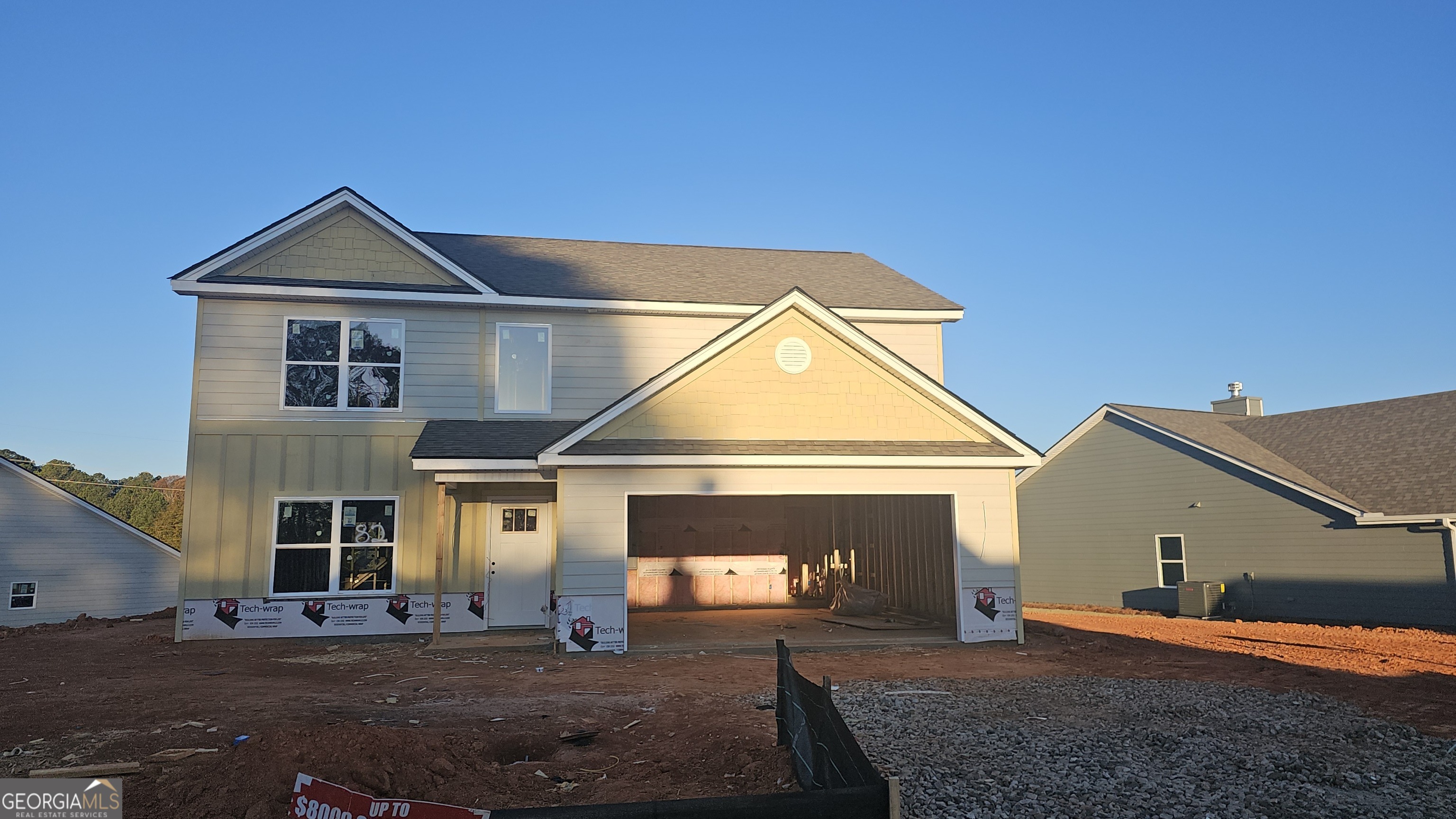 a front view of a house with yard