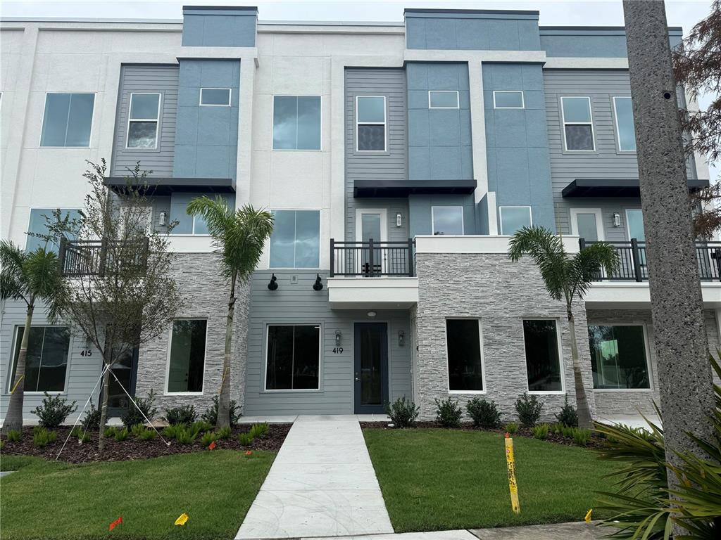 a front view of a house with a yard