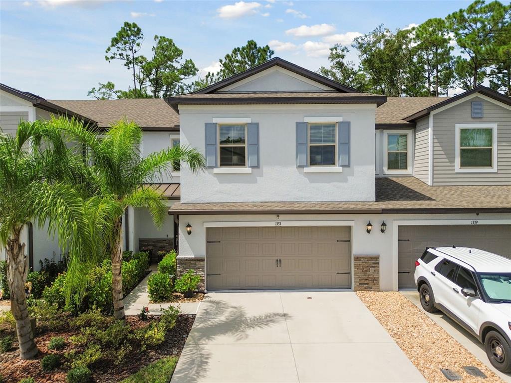 a front view of a house with a garage