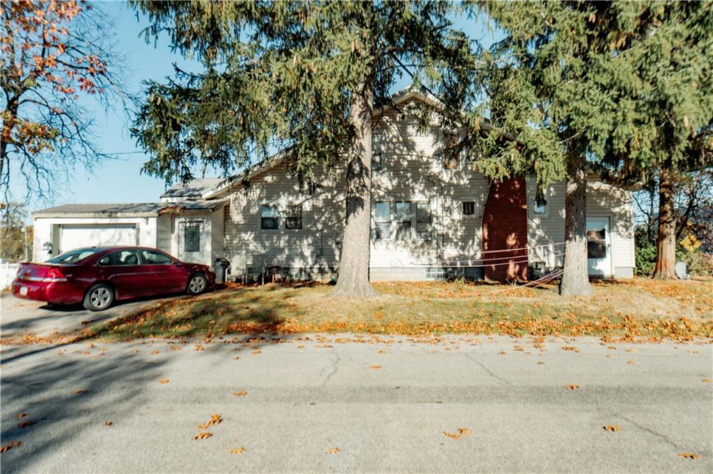 a view of a yard with a large tree