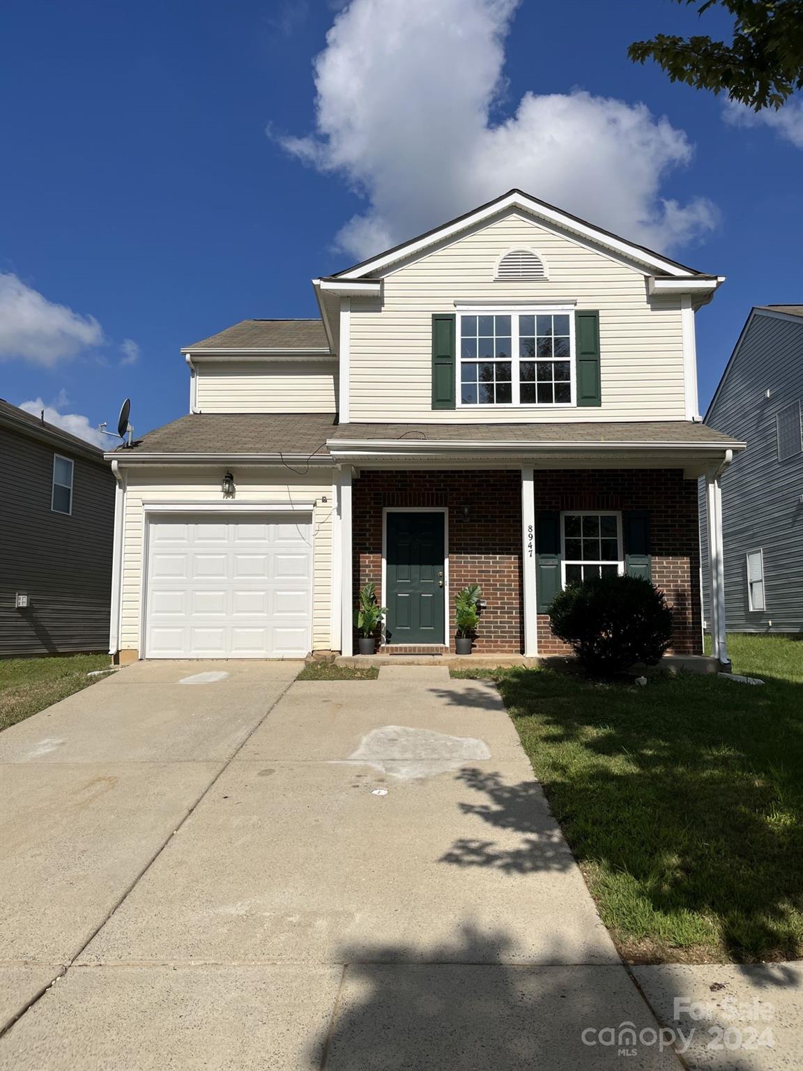 front view of a house with a yard