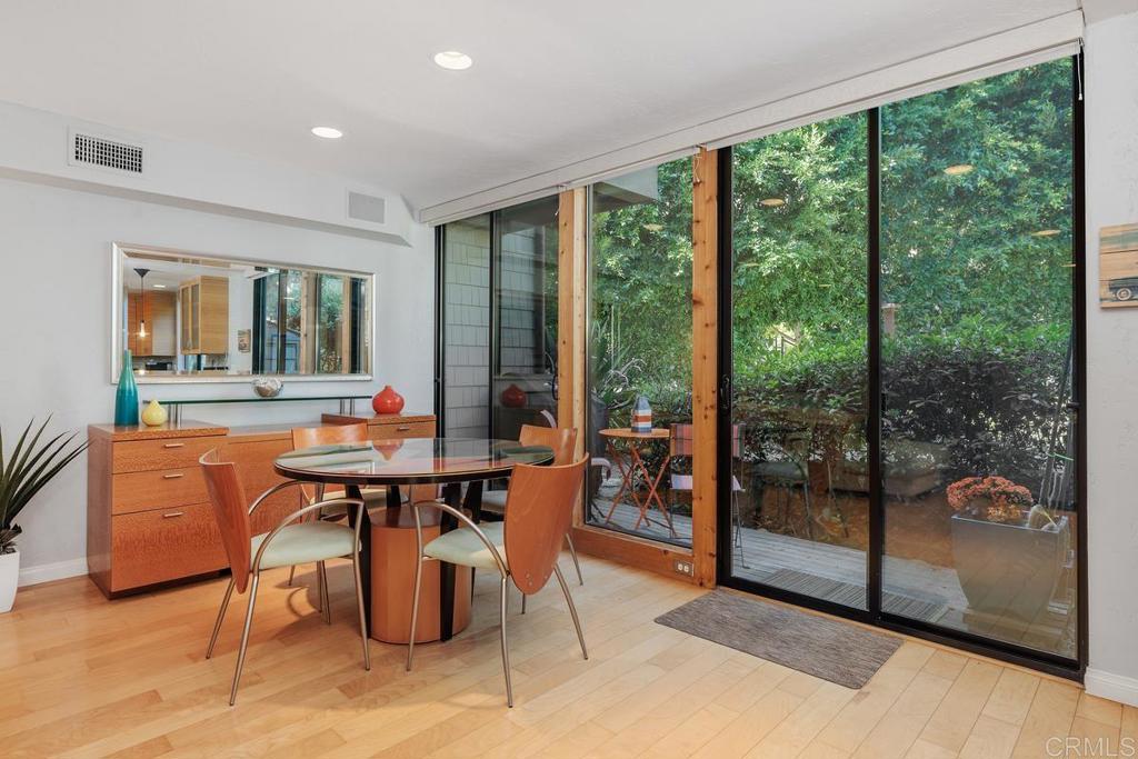 a view of a dining room with furniture window and outside view