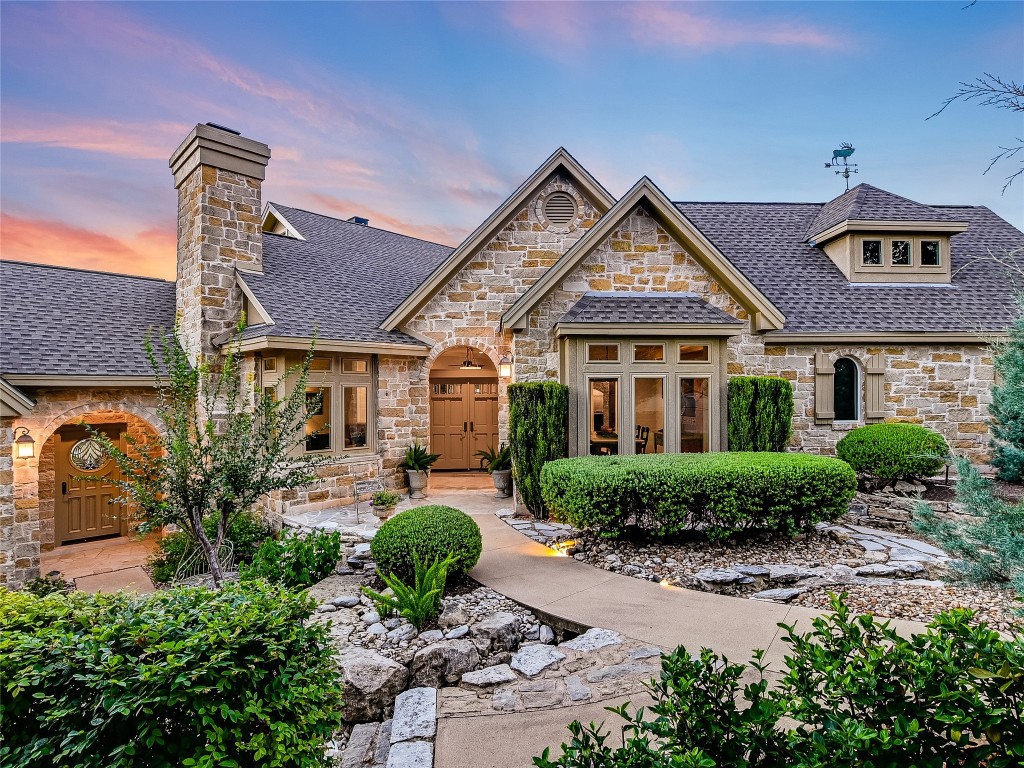 Intricately designed courtyards with winding pathways surrounded by flourishing landscaping greet you as you approach the front door.