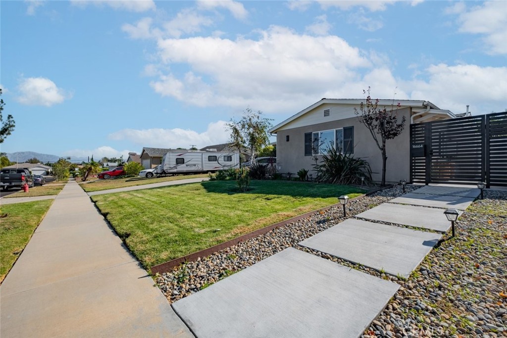 a view of a yard in front of a house