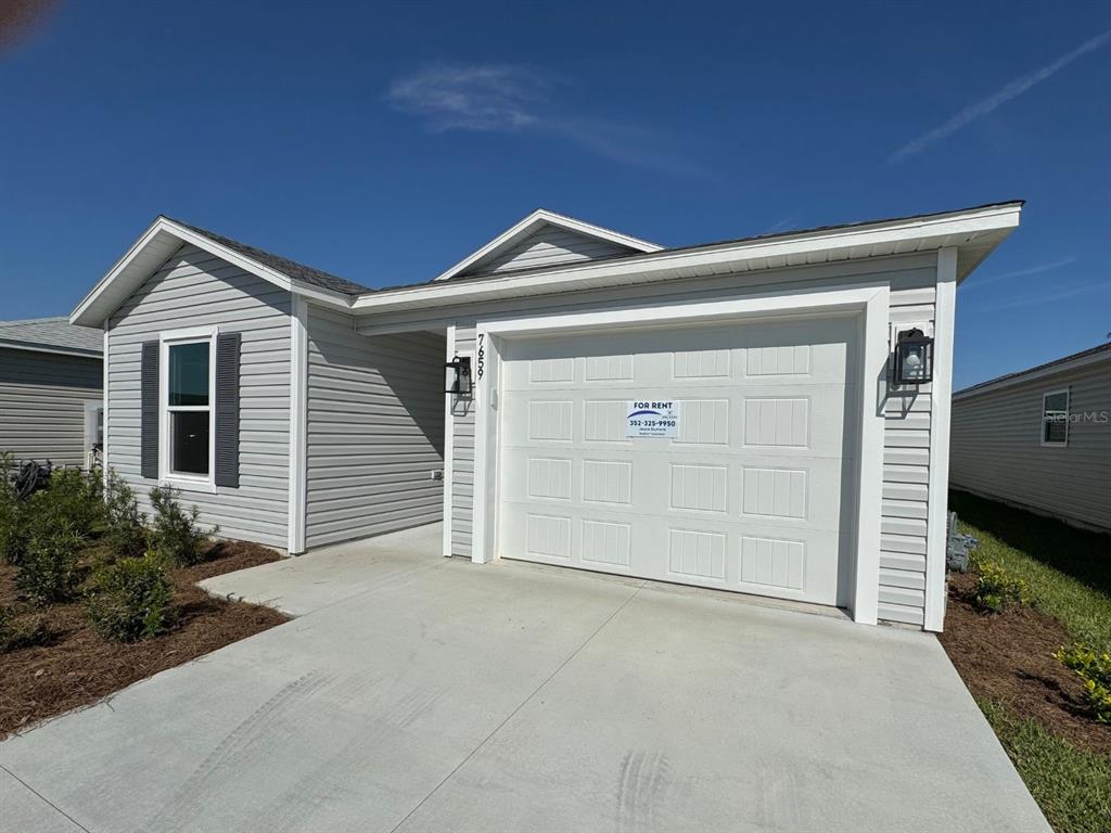 a front view of a house with garage