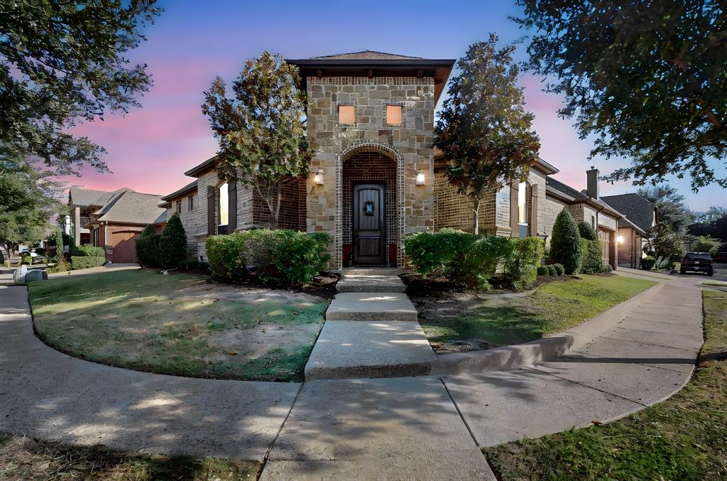 a front view of a house with garden