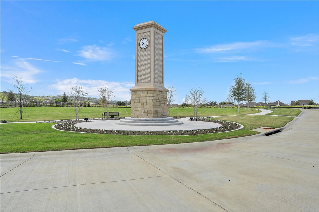 a view of a park with a big house