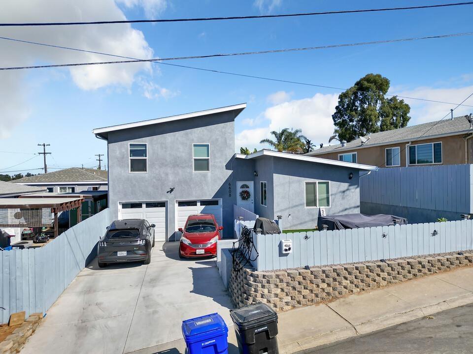 a view of a car park in front of house