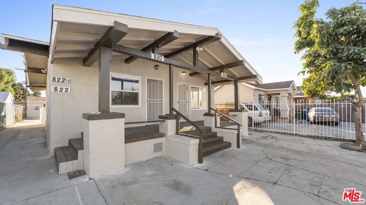 a view of living room kitchen and patio