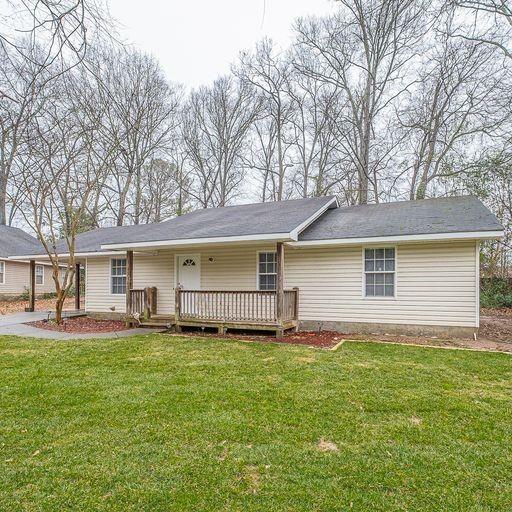 a house that has a big yard in front of it