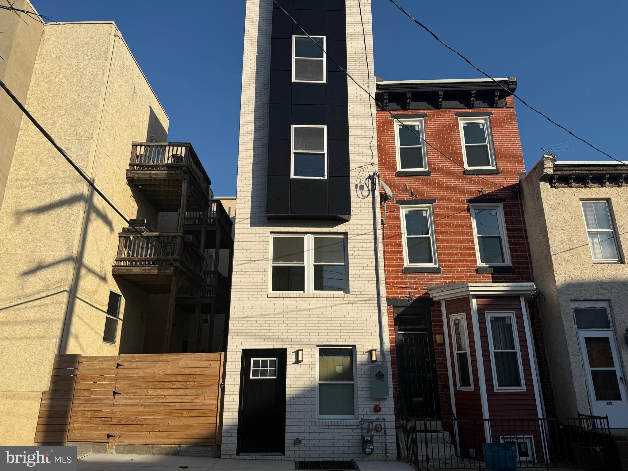 a front view of a house with many windows