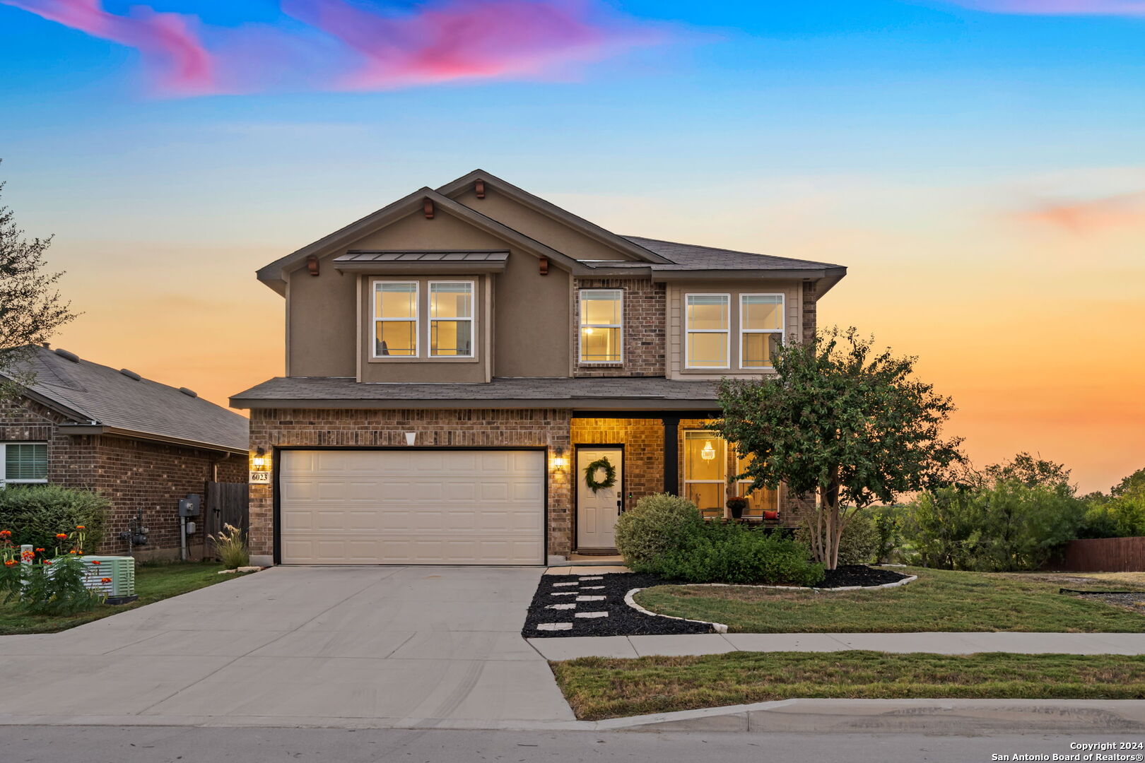 a front view of a house with a yard