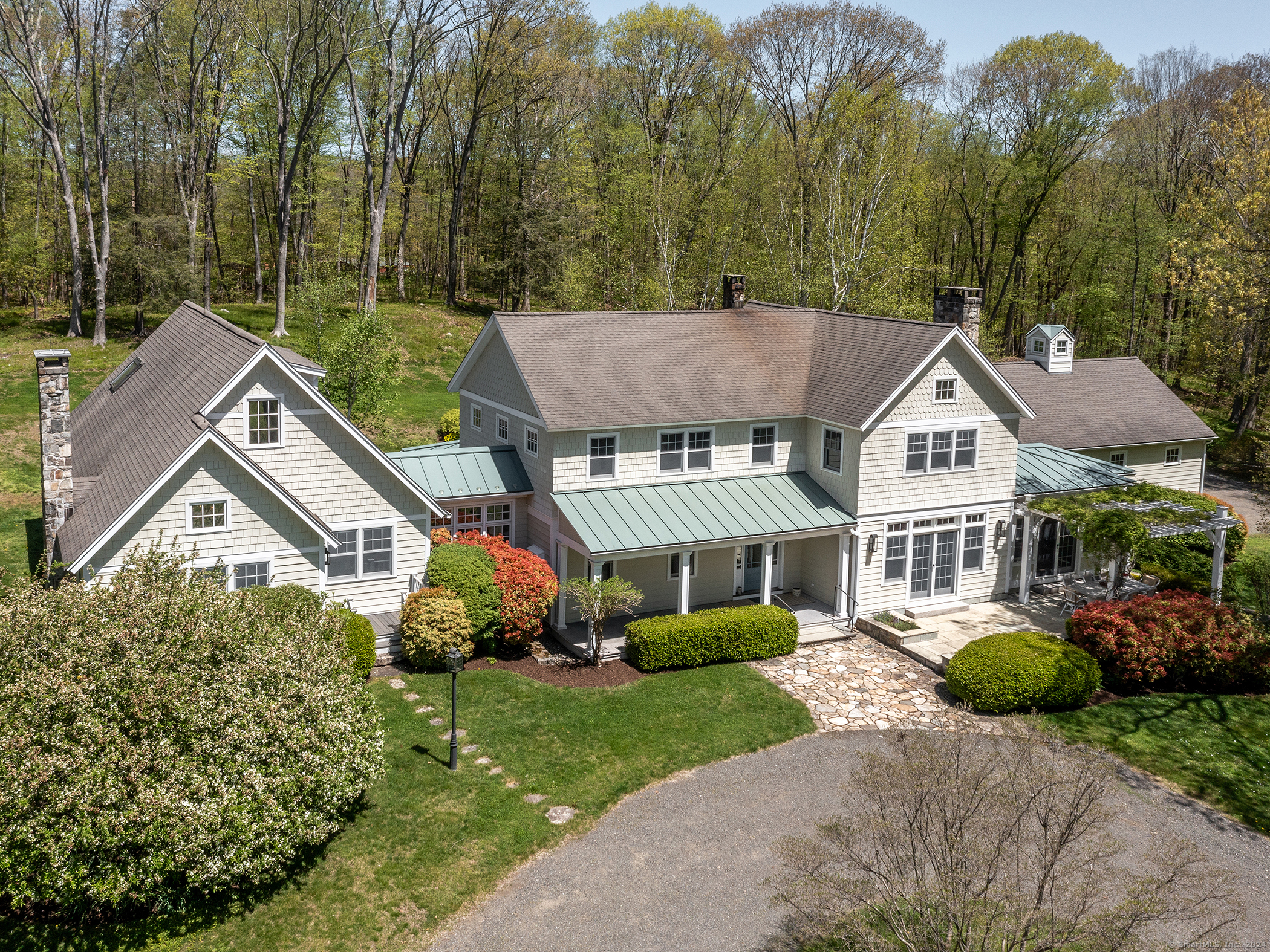 a aerial view of a house next to a yard