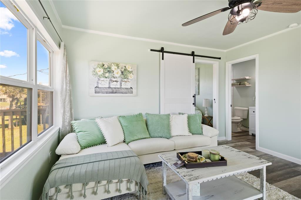 a living room with furniture and a window