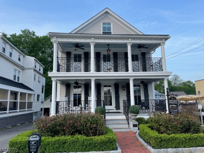 front view of brick house with a yard