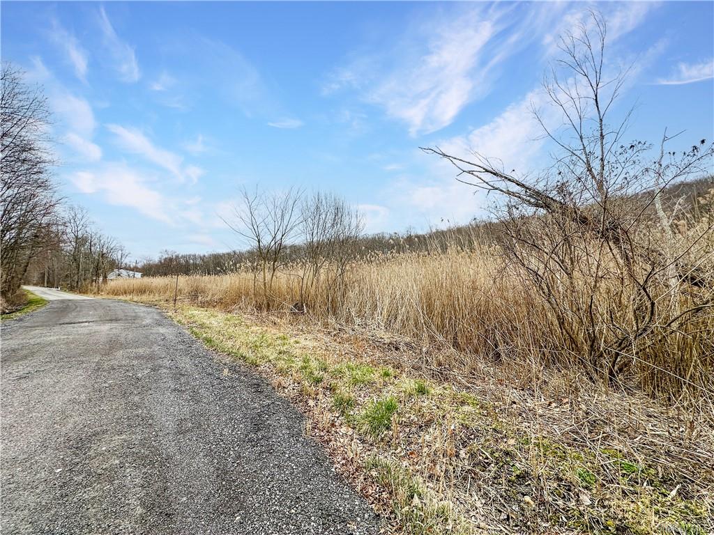 a view of a lake with a yard