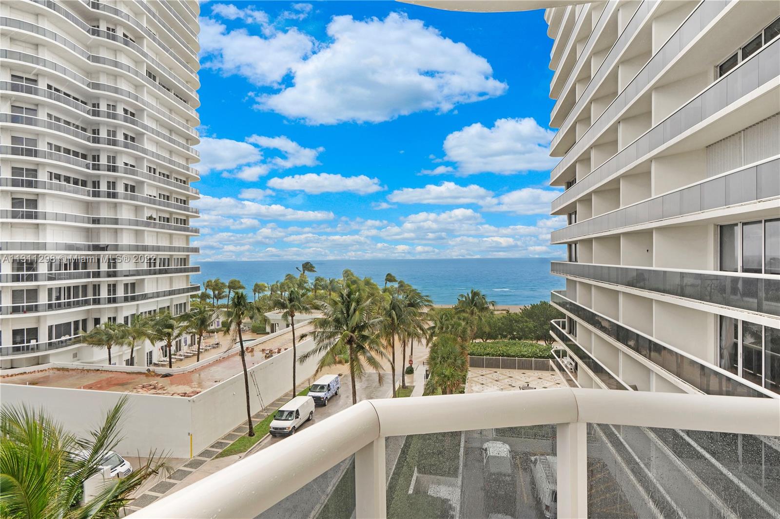 a view of a balcony with an ocean view