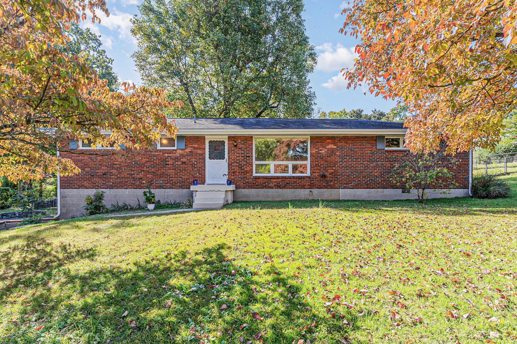 front view of a house with a yard