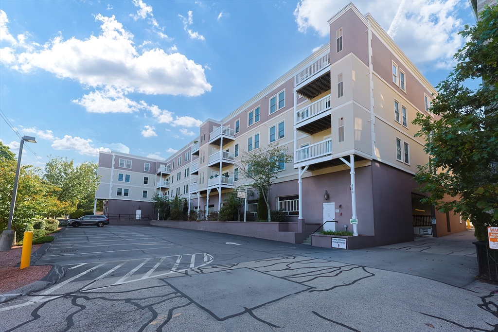 a view of a building with a yard