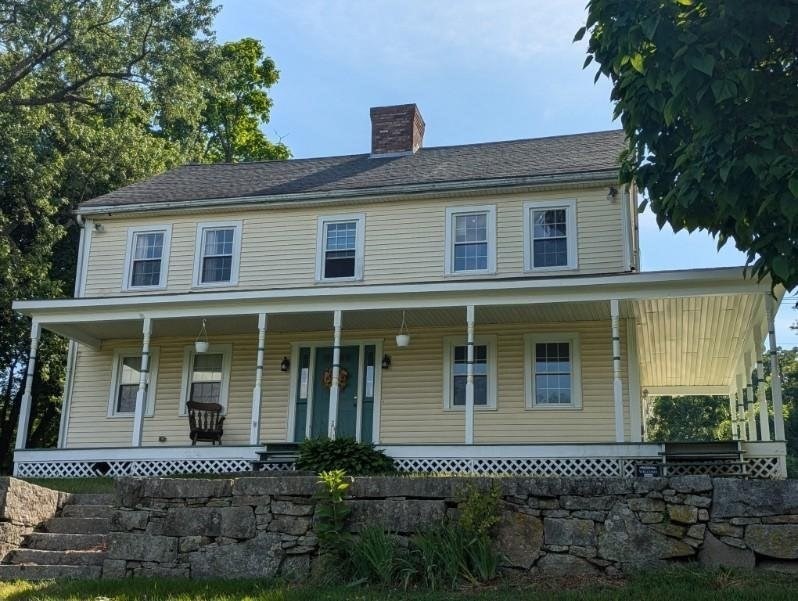 front view of a house with a yard