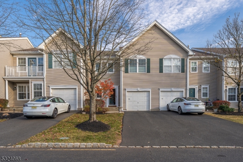 a view of a car parked in front of a house