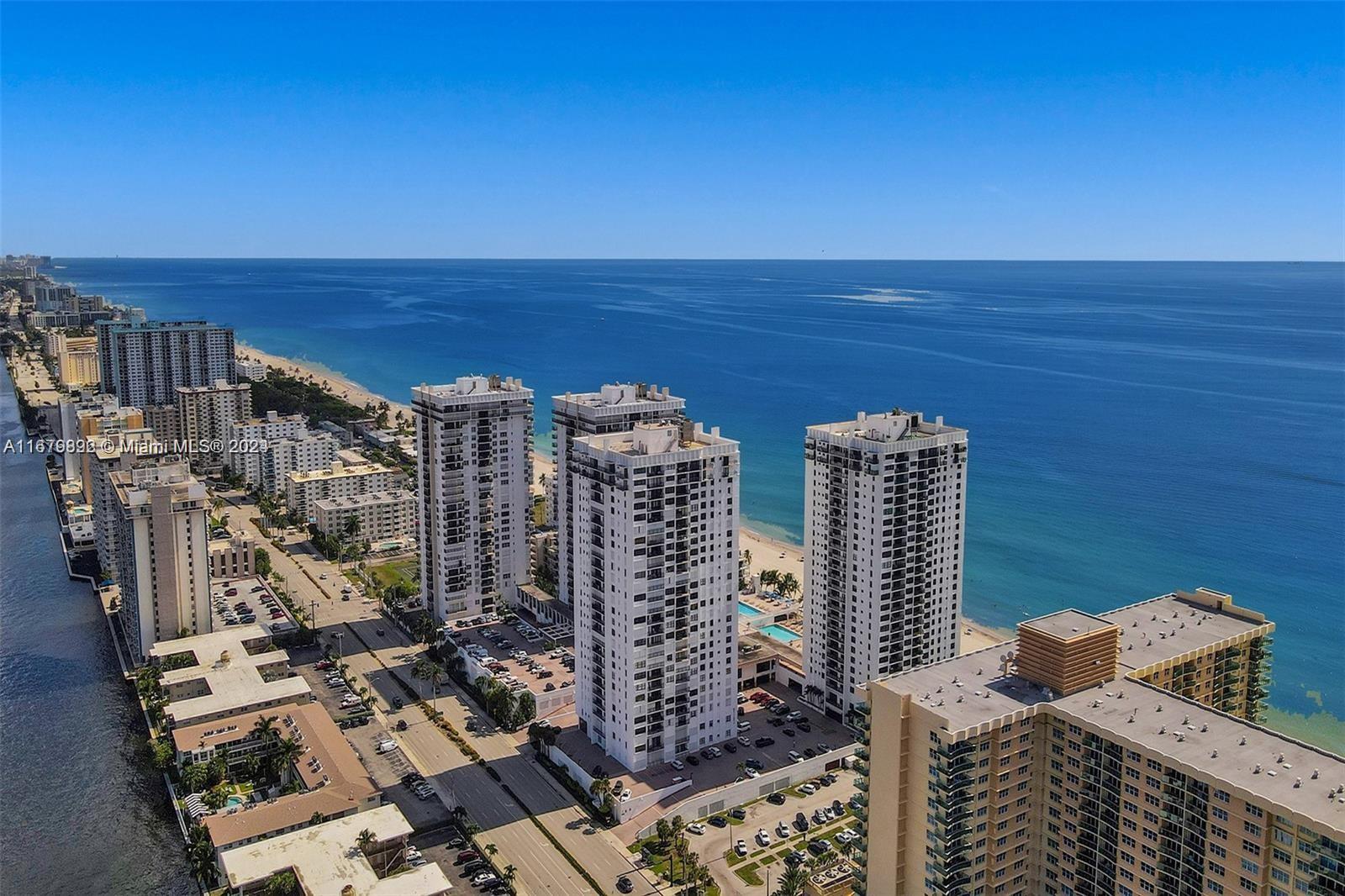 a view of city with ocean